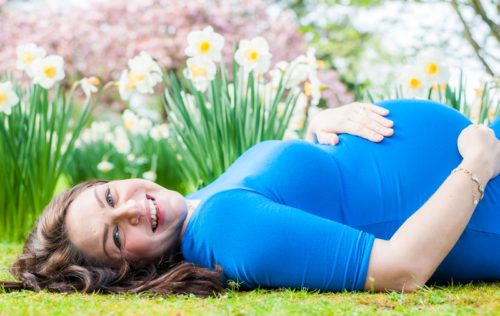 Radha laughing on her maternity photo session in Cumbria