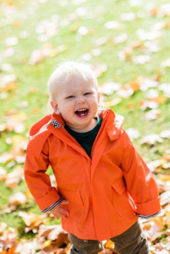 Laughing baby on family photographs in Keswick