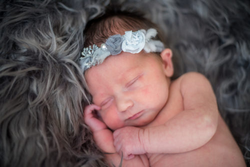 Sleeping newborn Abby on her baby photo session