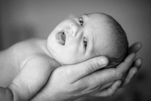Nova in Dad's hands - baby photographer Carlisle