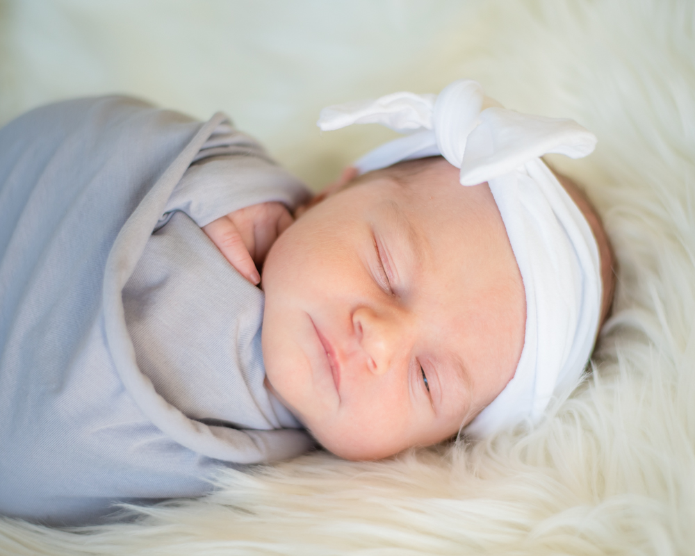 Baby Murphy posing in bow, Whitehaven newborn photographers