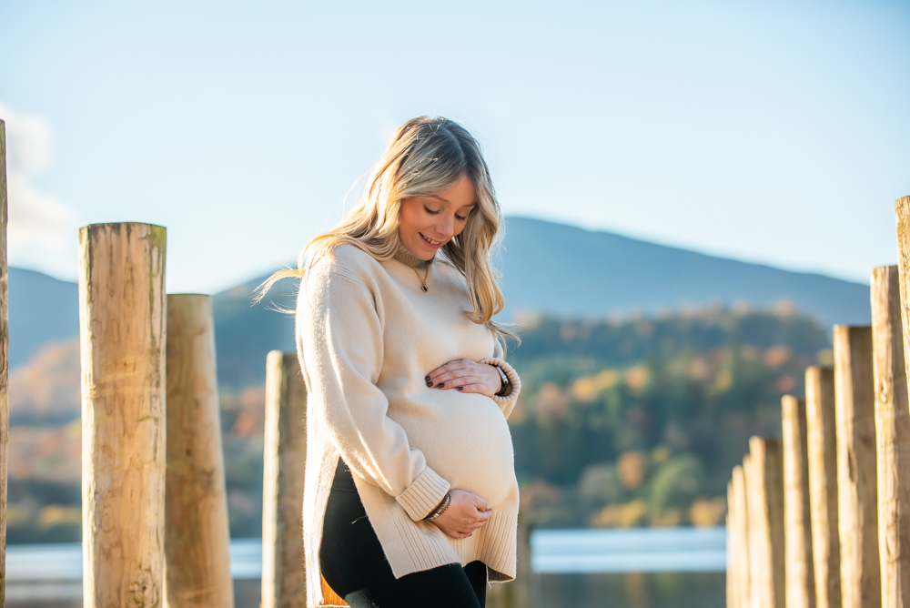 Iona cradling baby bump, maternity portraits Keswick, Lake District