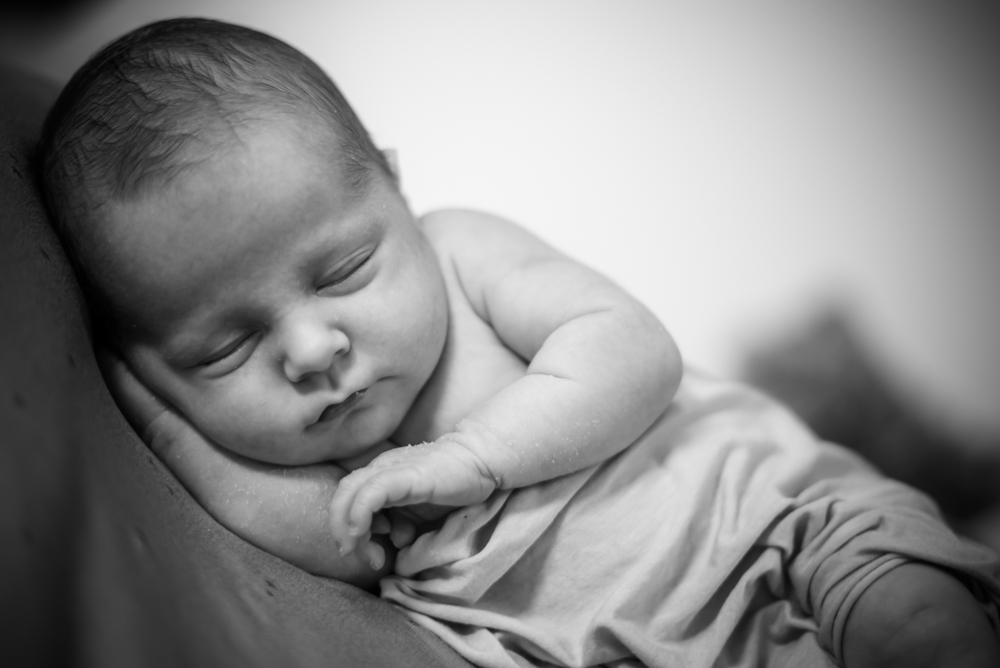 Baby sleeping on hands, newborn photographers Wigton